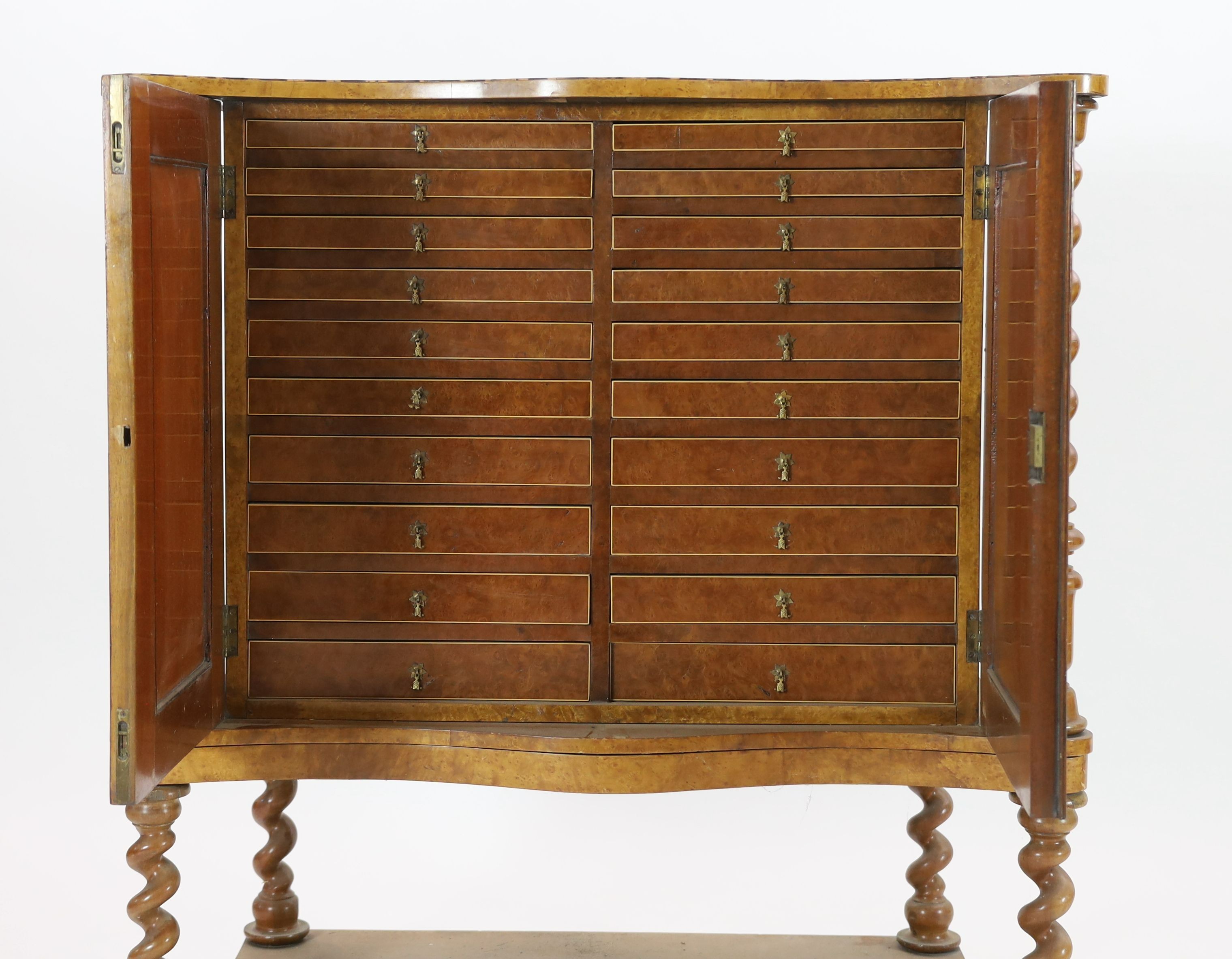A 19th century Irish yew wood, oyster veneered and burr wood serpentine collector's cabinet, W.118cm D.57cm H.128cm